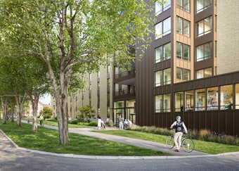 En gul byggnad med entré mot en allé