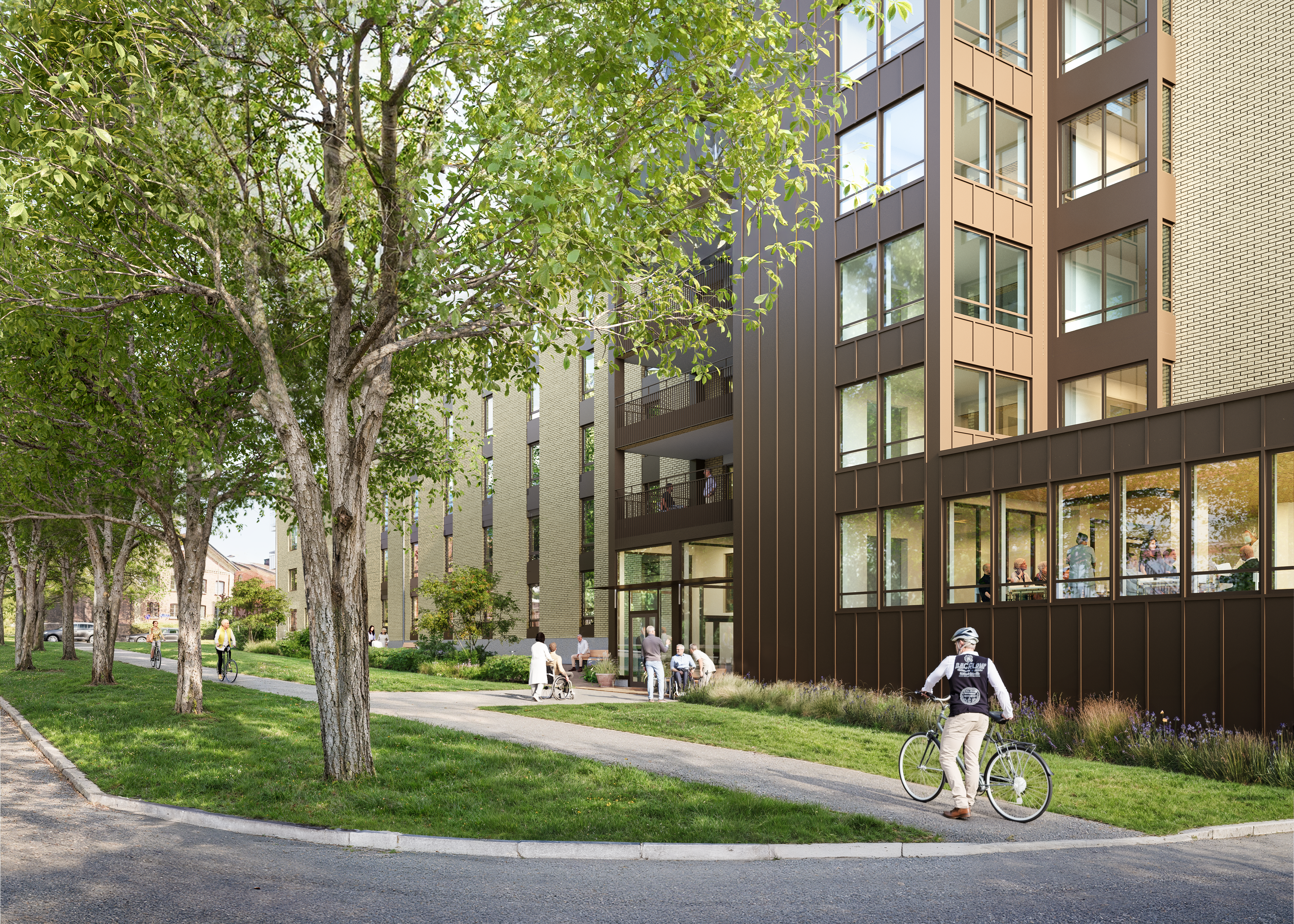 En gul byggnad med entré mot en allé