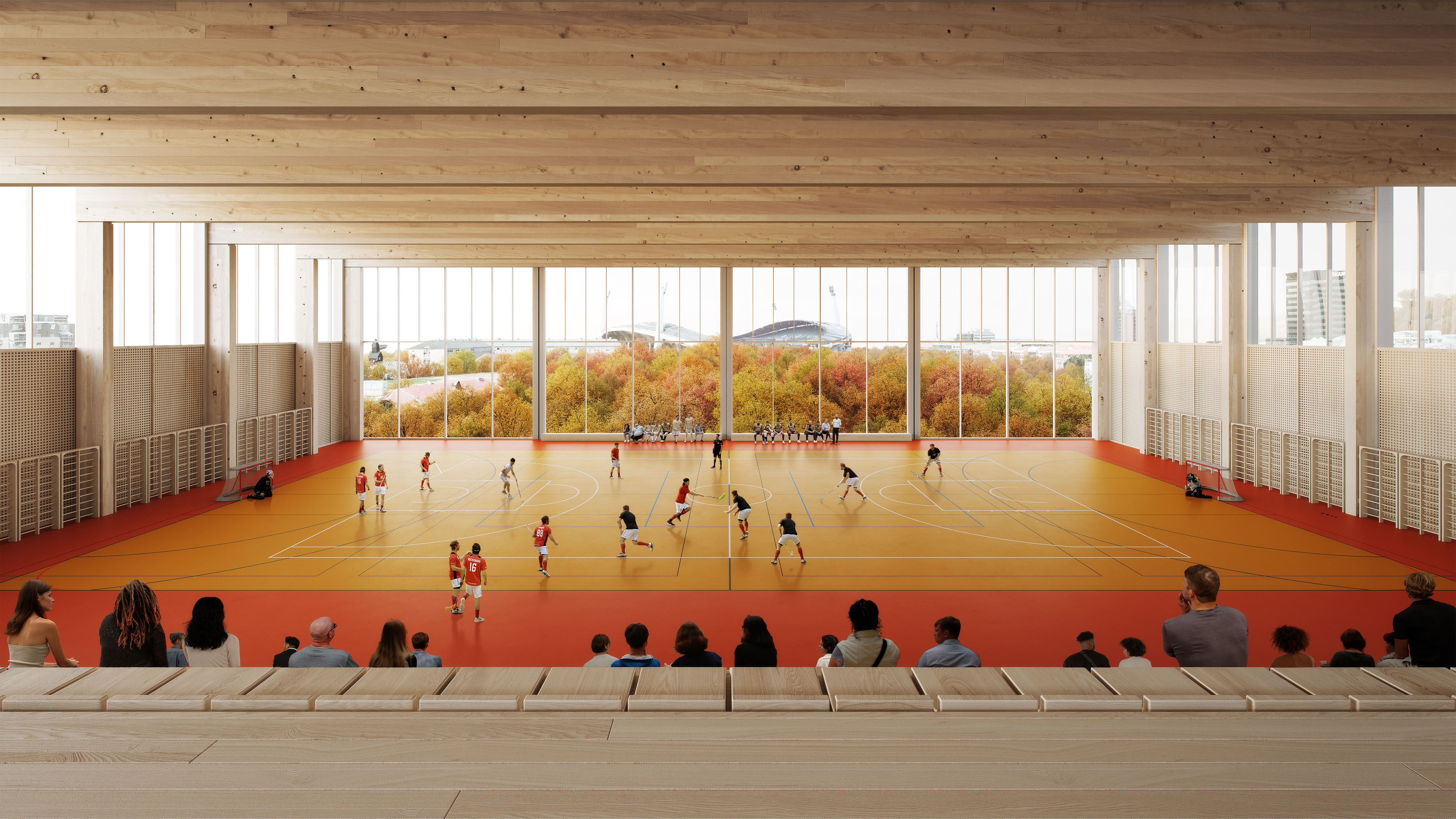 En sporthall d&auml;r personer spelar innebandy