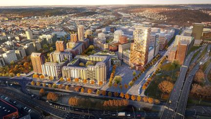 Flygbild över Backaplan Centrum med skiss på byggnader som ska byggas på platsen.