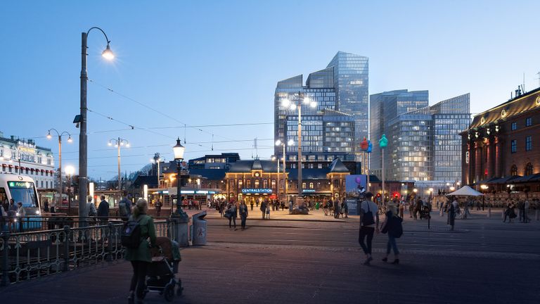 Visionsbild av drottningtorget kvällstid med stora glasbyggnader bakom centralstationen.