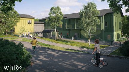 En grön tvåvåningsbyggnad i trä.