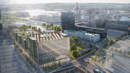 Visionsbild av centralstationen, en byggnad i glas med inslag av grönska och solpaneler på taket.