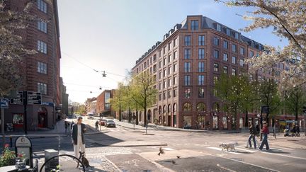 Bild på ett rödbrunt hörnhus som ska ligga i Lorensbergsparken