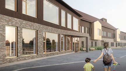 Erkisboskolan med några personer i bakgrunden.