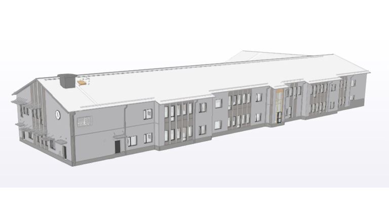 Visionsbild av Brunnsboskolans Baksida. En grå byggnad med vitt tak