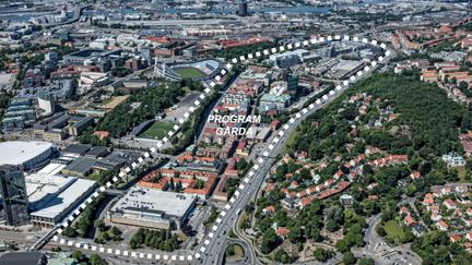 Flygvy över stadsområdet gårda där projektetområdet är markerat med streckade linjer.